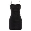 Black ruched dress on a white background
